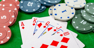 Cards and chips on a green background. Card gambling concept